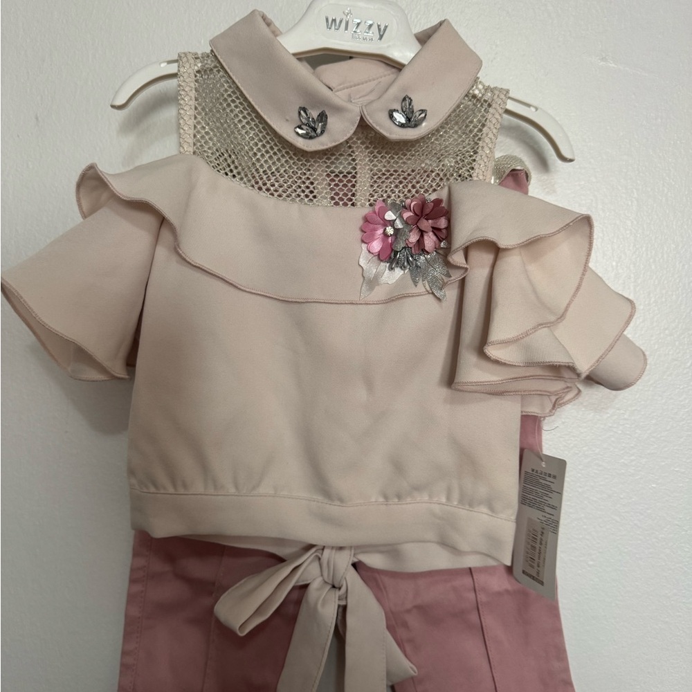 Pink Ruffle Top with Floral Accent